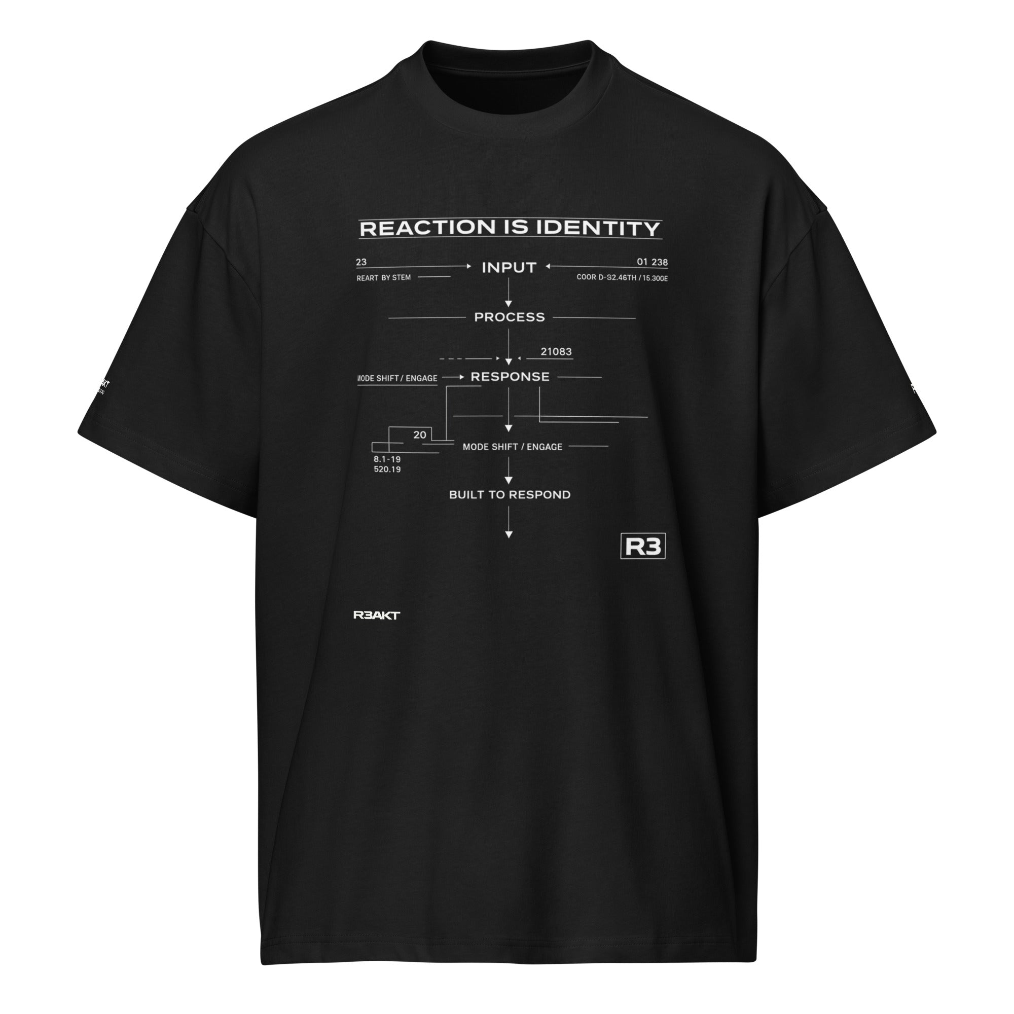REAKT R3 black oversized T-shirt featuring a white technical flowchart graphic with the text "Reaction Is Identity", "Input", "Process", "Response", and "Built to Respond" printed on the front

