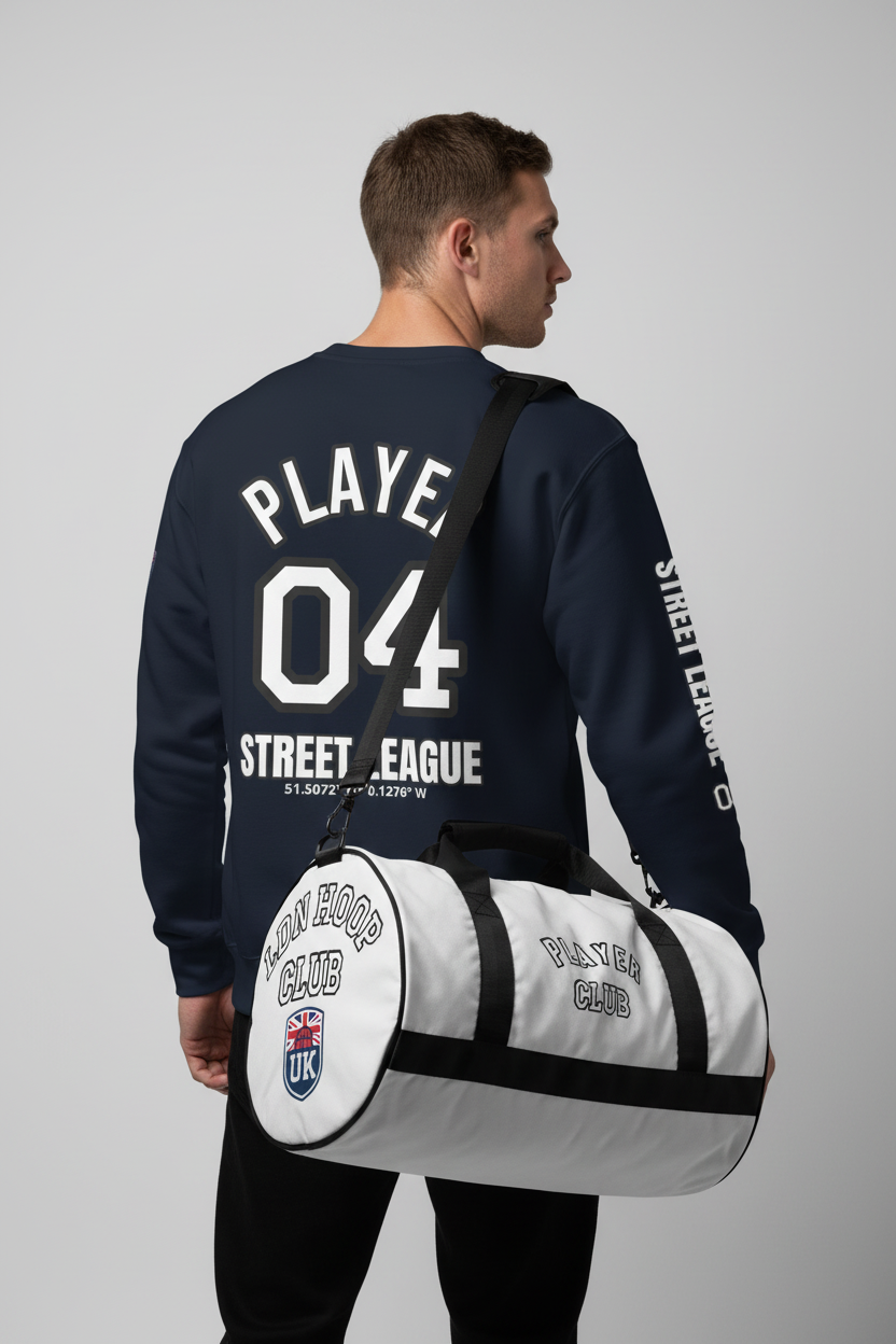 Model back view wearing navy LDN Hoop Club sweatshirt with gym bag